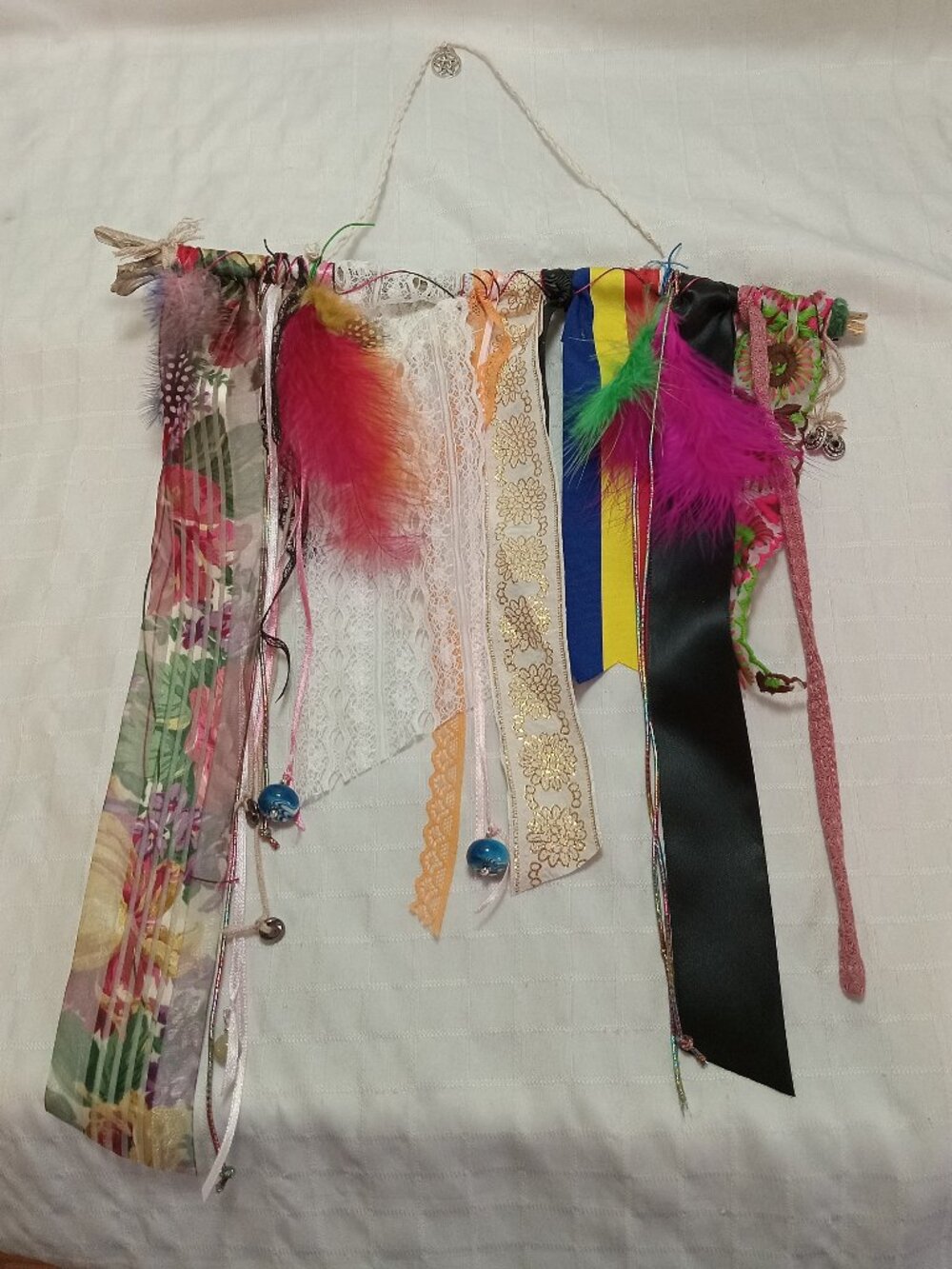 Handcrafted artistic banner made from treated driftwood, ribbons & decorations